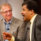 Nobel laureate Thomas Cech looks on as astrophysicist Neil deGrasse Tyson addresses high school students at the Howard Hughes Medical Institute. Chevy Chase, MD.